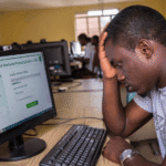 Stressed student checking admission status