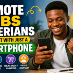 Young Nigerian man smiling while holding a smartphone, celebrating success from remote work, with bold text “Remote Jobs Nigerians Can Start With Just a Smartphone”