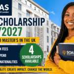 Smiling African female student holding books in London with SOAS University of London branding, university building