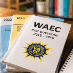 Students studying WAEC past questions and answers from 2015 to 2025 with exam booklets, notebook, and study materials on a wooden desk in a bright realistic learning environment.